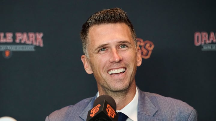 Oct 1, 2024; San Francisco, CA, USA; San Francisco Giants president of baseball operations Buster Posey reacts during an introductory press conference at Oracle Park.  Mandatory Credit: Robert Edwards-Imagn Images