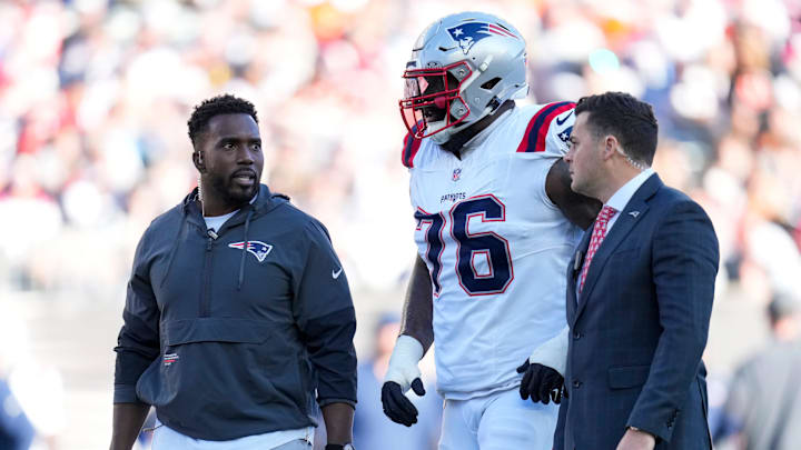 New England Patriots offensive tackle Morgan Moses (76) walks for the locker room with an injury in the second quarter of the NFL Week 12 game between the Cincinnati Bengals and the New England Patriots at Paycor Stadium in downtown Cincinnati on Sunday, Nov. 23, 2025. New England Patriots offensive tackle Morgan Moses (76) walks for the locker room with an injury in the second quarter of the NFL Week 12 game between the Cincinnati Bengals and the New England Patriots at Paycor Stadium in downtown Cincinnati on Sunday, Nov. 23, 2025.