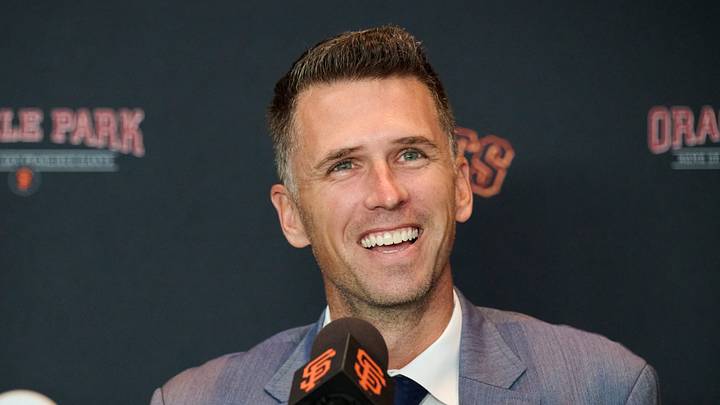San Francisco, CA, USA; San Francisco Giants president of baseball operations Buster Posey reacts during an introductory press conference at Oracle Park.  Mandatory Credit: Robert Edwards-Imagn Images