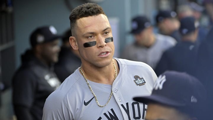 Oct 25, 2024; Los Angeles, California, USA; New York Yankees outfielder Aaron Judge (99) looks on in the dugout before game one against the Los Angeles Dodgers in the 2024 MLB World Series at Dodger Stadium. Mandatory Credit: Jayne Kamin-Oncea-Imagn Images