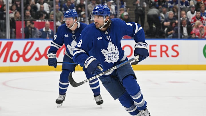 Sep 26, 2024; Toronto, Ontario, CAN;  Toronto Maple Leafs defenseman Chris Tanev (8) tracks the play as defenseman Morgan Rielly (44) looks on against the Montreal Canadiens in the second period at Scotiabank Arena. Mandatory Credit: Dan Hamilton-Imagn Images