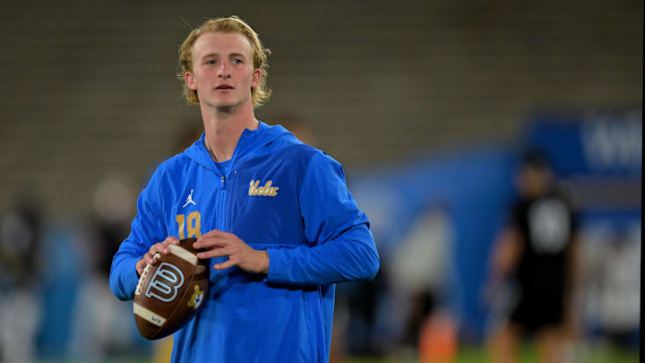 Pasadena, California, USA;  UCLA Bruins quarterback Henry Hasselbeck (18) warms up prior to the game against the Washington Huskies at Rose Bowl.
