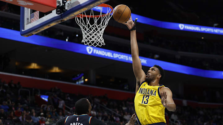 Jan 17, 2026; Detroit, Michigan, USA;  Indiana Pacers center Tony Bradley (13) shoots on Detroit Pistons guard Javonte Green (31) in the second half at Little Caesars Arena. Mandatory Credit: Rick Osentoski-Imagn Images