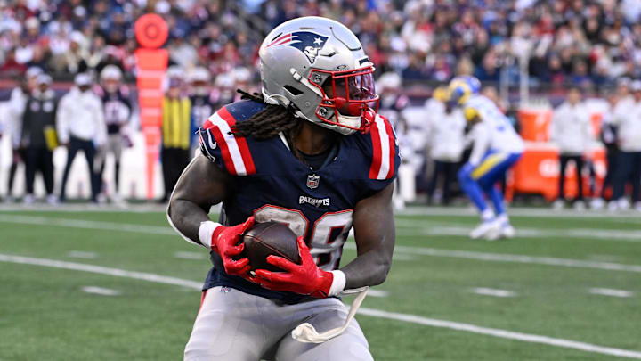 Nov 17, 2024; Foxborough, Massachusetts, USA; New England Patriots running back Rhamondre Stevenson (38) runs the ball against the Los Angeles Rams during the second half at Gillette Stadium. Mandatory Credit: Eric Canha-Imagn Images Nov 17, 2024; Foxborough, Massachusetts, USA; New England Patriots running back Rhamondre Stevenson (38) runs the ball against the Los Angeles Rams during the second half at Gillette Stadium. Mandatory Credit: Eric Canha-Imagn Images