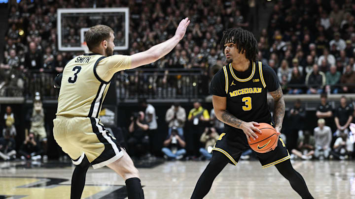 Feb 17, 2026; West Lafayette, Indiana, USA; Michigan Wolverines guard Elliot Cadeau (3) controls the ball as  Purdue Boilermakers guard Braden Smith (3) defends during the first half at Mackey Arena. Mandatory Credit: Marc Lebryk-Imagn Images