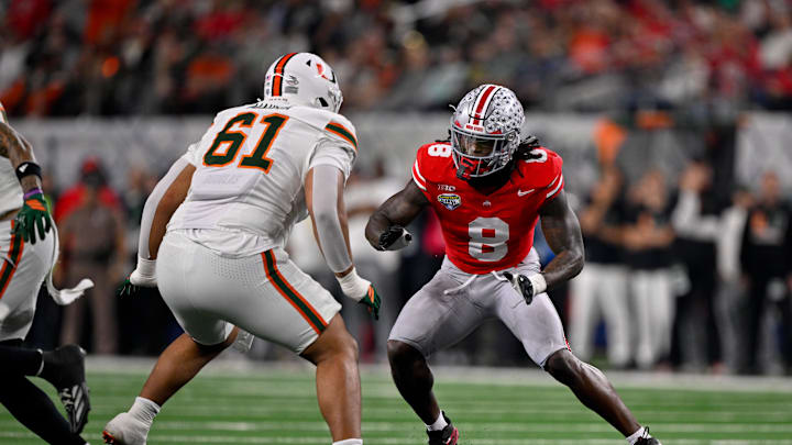 Dec 31, 2025; Arlington, TX, USA; Miami Hurricanes offensive lineman Francis Mauigoa (61) blocks Ohio State Buckeyes linebacker Arvell Reese (8) during the 2025 Cotton Bowl and quarterfinal game of the College Football Playoff at AT&T Stadium. Mandatory Credit: Jerome Miron-Imagn Images Dec 31, 2025; Arlington, TX, USA; Miami Hurricanes offensive lineman Francis Mauigoa (61) blocks Ohio State Buckeyes linebacker Arvell Reese (8) during the 2025 Cotton Bowl and quarterfinal game of the College Football Playoff at AT&T Stadium. Mandatory Credit: Jerome Miron-Imagn Images