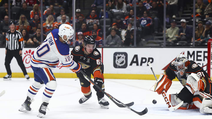 Edmonton Oilers center Derek Ryan (10) shoots against Anaheim Ducks defenseman Jackson LaCombe (60)