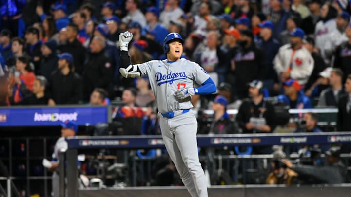 Oct 17, 2024; New York City, New York, USA; Los Angeles Dodgers two-way player Shohei Ohtani (17) reacts after hitting a solo home run against the New York Mets in the first inning during game four of the NLCS for the 2024 MLB playoffs at Citi Field. Mandatory Credit: John Jones-Imagn Images Oct 17, 2024; New York City, New York, USA; Los Angeles Dodgers two-way player Shohei Ohtani (17) reacts after hitting a solo home run against the New York Mets in the first inning during game four of the NLCS for the 2024 MLB playoffs at Citi Field. Mandatory Credit: John Jones-Imagn Images