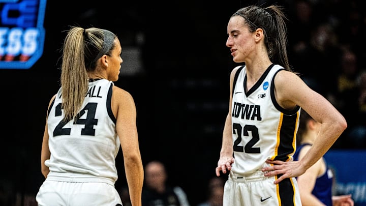 Iowa guard Caitlin Clark (22) talks with Iowa guard Gabbie Marshall (24) during a free throw during an NCAA tournament first round game at Carver-Hawkeye Arena on Saturday, March 23, 2024, in Iowa City. Iowa guard Caitlin Clark (22) talks with Iowa guard Gabbie Marshall (24) during a free throw during an NCAA tournament first round game at Carver-Hawkeye Arena on Saturday, March 23, 2024, in Iowa City.