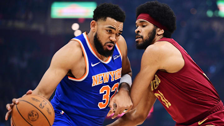 Apr 2, 2025; Cleveland, Ohio, USA;  New York Knicks center Karl-Anthony Towns (32) drives to the basket against Cleveland Cavaliers center Jarrett Allen (31) during the first quarter at Rocket Arena. Mandatory Credit: Ken Blaze-Imagn Images