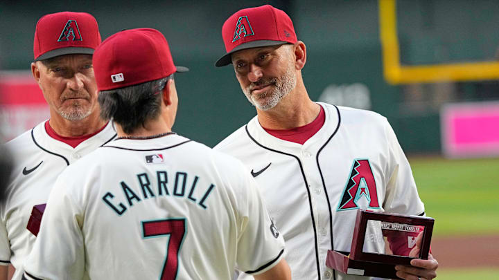 Diamondbacks manager Torey Lovullo shakes the hand of outfielder Corbin Carroll as the team are passed out National League Championship Rings prior to a game against the Rockies at Chase Field on March 29, 2024. Diamondbacks manager Torey Lovullo shakes the hand of outfielder Corbin Carroll as the team are passed out National League Championship Rings prior to a game against the Rockies at Chase Field on March 29, 2024.