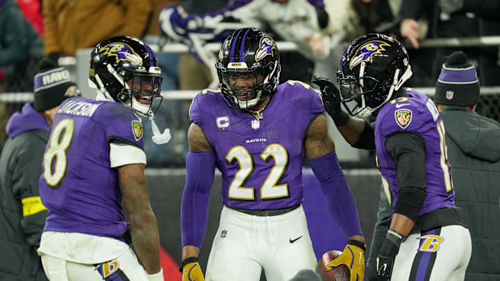 Jan 11, 2025; Baltimore, Maryland, USA; Baltimore Ravens running back Derrick Henry (22) celebrates with wide receiver Nelson Agholor (15) and quarterback Lamar Jackson (8) after scoring a touchdown against the Pittsburgh Steelers in the third quarter in an AFC wild card game at M&T Bank Stadium. Mandatory Credit: Mitch Stringer-Imagn Images
