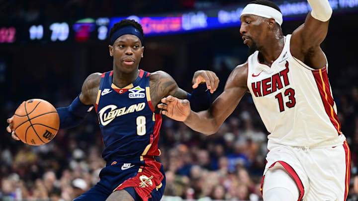 Mar 27, 2026; Cleveland, Ohio, USA; Cleveland Cavaliers guard Dennis Schroder (8) drives to the basket against Miami Heat center Bam Adebayo (13) during the second half at Rocket Arena. Mandatory Credit: Ken Blaze-Imagn Images