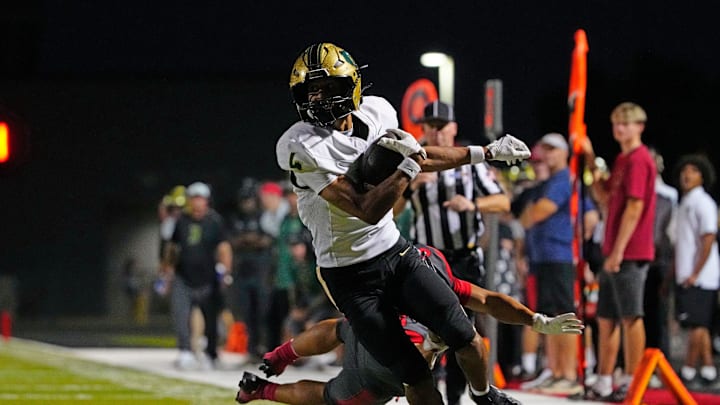 Basha wide receiver Kash Brock (4) breaks a tackle against Williams Field defensive back Bryson Raspberry (7) on his way to a touchdown during a game at Williams Field High School in Gilbert, on Sept. 12, 2025.