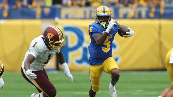 Sep 6, 2025; Pittsburgh, Pennsylvania, USA;  Pittsburgh Panthers wide receiver Raphael Williams Jr. (5) runs after catch against Central Michigan Chippewas linebacker Dakota Cochran (1) during the first quarter at Acrisure Stadium. Mandatory Credit: Charles LeClaire-Imagn Images