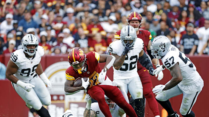 Sep 21, 2025; Landover, Maryland, USA; Washington Commanders defensive back Car'Lin Vigers (22) runs the ball during the second half against the Las Vegas Raiders at Northwest Stadium. Mandatory Credit: Amber Searls-Imagn Images Sep 21, 2025; Landover, Maryland, USA; Washington Commanders defensive back Car'Lin Vigers (22) runs the ball during the second half against the Las Vegas Raiders at Northwest Stadium. Mandatory Credit: Amber Searls-Imagn Images
