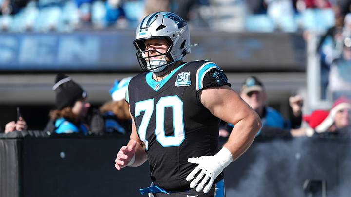 Dec 22, 2024; Charlotte, North Carolina, USA; Carolina Panthers guard Brady Christensen (70) takes the field during the first quarter against the Arizona Cardinals at Bank of America Stadium. Mandatory Credit: Jim Dedmon-Imagn Images