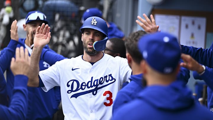 Apr 27, 2025; Los Angeles, California, USA; Los Angeles Dodgers outfielder Chris Taylor (3) celebrates with teammates in the dugout after scoring against the Pittsburgh Pirates during the sixth inning at Dodger Stadium. Mandatory Credit: Jonathan Hui-Imagn Images