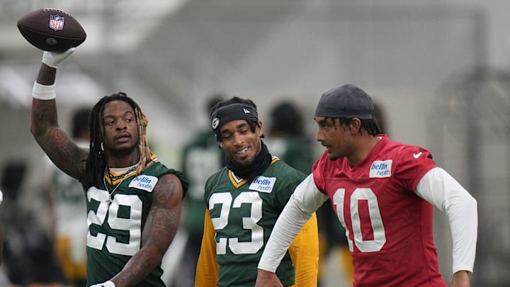 Quarterback Jordan Love (10) jokes around with cornerback Jaire Alexander (23) and safety Xavier McKinney (29) during organized team activities for the Green Bay Packers Tuesday, May 21, 2024 in Green Bay, Wisconsin.