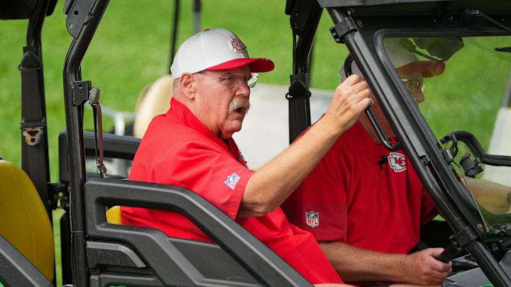 Jul 22, 2025; St. Joseph, MO, USA; Kansas City Chiefs head coach Andy Reid rides a cart down the hill to the fields prior to training camp at Missouri Western State University. Mandatory Credit: Denny Medley-Imagn Images