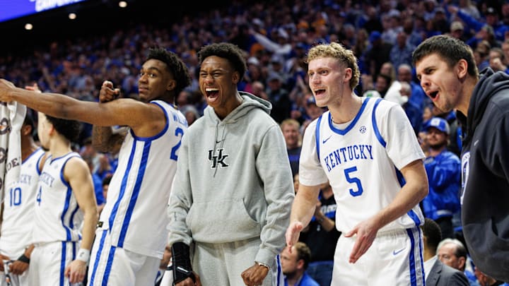 Feb 11, 2025; Lexington, Kentucky, USA; Kentucky Wildcats center Amari Williams (22), guard Jaxson Robinson (2), guard Collin Chandler (5) and guard Kerr Kriisa (77) celebrate from the bench during the first half against the Tennessee Volunteers at Rupp Arena at Central Bank Center. Mandatory Credit: Jordan Prather-Imagn Images