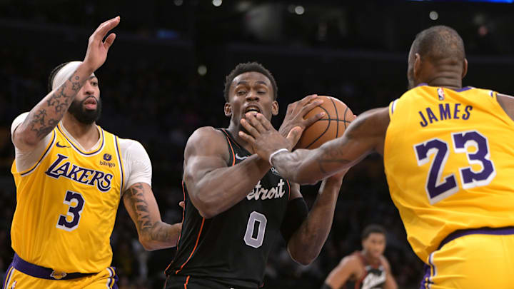 Feb 13, 2024; Los Angeles, California, USA; Detroit Pistons center Jalen Duren (0) is defended by Los Angeles Lakers forward Anthony Davis (3) and forward LeBron James (23) in the second half at Crypto.com Arena. Mandatory Credit: Jayne Kamin-Oncea-Imagn Images Feb 13, 2024; Los Angeles, California, USA; Detroit Pistons center Jalen Duren (0) is defended by Los Angeles Lakers forward Anthony Davis (3) and forward LeBron James (23) in the second half at Crypto.com Arena. Mandatory Credit: Jayne Kamin-Oncea-Imagn Images