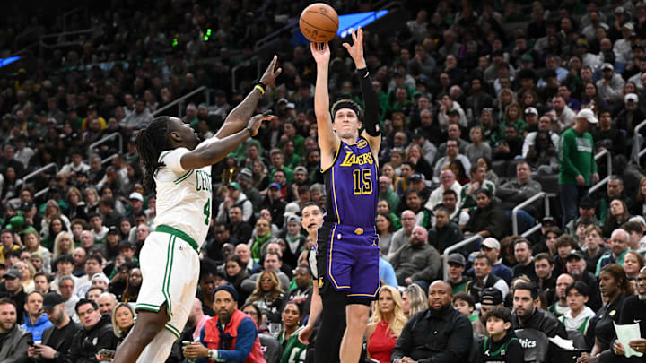 Mar 8, 2025; Boston, Massachusetts, USA; Los Angeles Lakers guard Austin Reaves (15) attempts a three-point basket against Boston Celtics guard Jrue Holiday (4) during the second quarter at the TD Garden. Mandatory Credit: Brian Fluharty-Imagn Images Mar 8, 2025; Boston, Massachusetts, USA; Los Angeles Lakers guard Austin Reaves (15) attempts a three-point basket against Boston Celtics guard Jrue Holiday (4) during the second quarter at the TD Garden. Mandatory Credit: Brian Fluharty-Imagn Images
