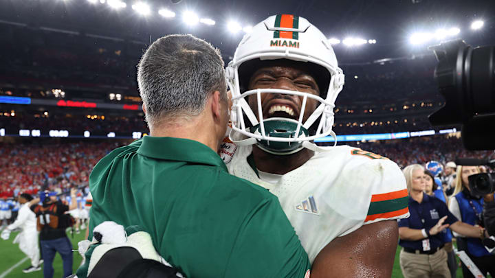 Samson Okunlola, Mario Cristobal, Miami Hurricanes Samson Okunlola, Mario Cristobal, Miami Hurricanes