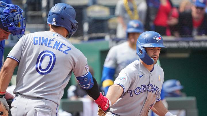 Sep 6, 2026; Kansas City, Missouri, USA; Toronto Blue Jays second baseman Josh Smith (9) celebrates with shortstop Andrés Giménez (0) against the Kansas City Royals after hitting a solo home run in the sixth inning at Kauffman Stadium. Mandatory Credit: Denny Medley-Imagn Images
