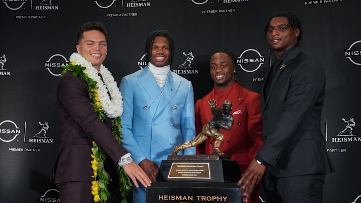 Dec 14, 2024; New York, NY, USA; From left, Heisman Trophy nominees Oregon Ducks quarterback Dillon Gabriel, Colorado Buffaloes wide receiver/cornerback Travis Hunter, Boise State Broncos running back Ashton Jeanty and Miami Hurricanes quarterback Cam Ward pose for a photo during a press conference before the 2024 Heisman Trophy Presentation. 