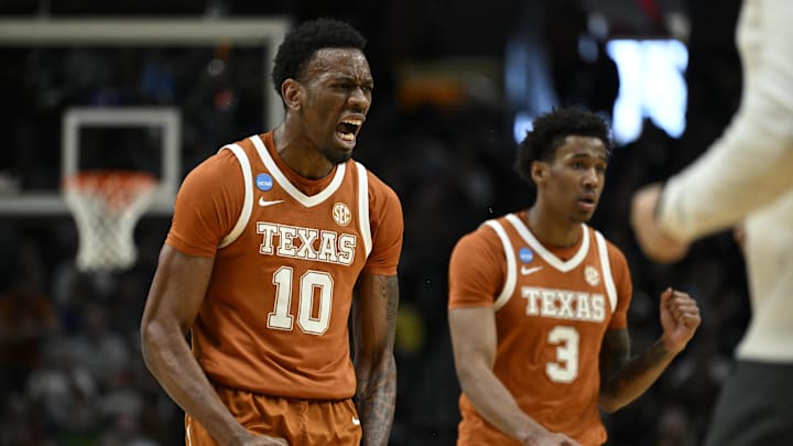 Mar 21, 2026; Portland, OR, USA; Texas Longhorns forward Nic Codie (10) and Texas Longhorns forward Dailyn Swain (3) react after a play in the first half against the Gonzaga Bulldogs during a second round game of the men's 2026 NCAA Tournament at Moda Center. Mandatory Credit: Troy Wayrynen-Imagn Images