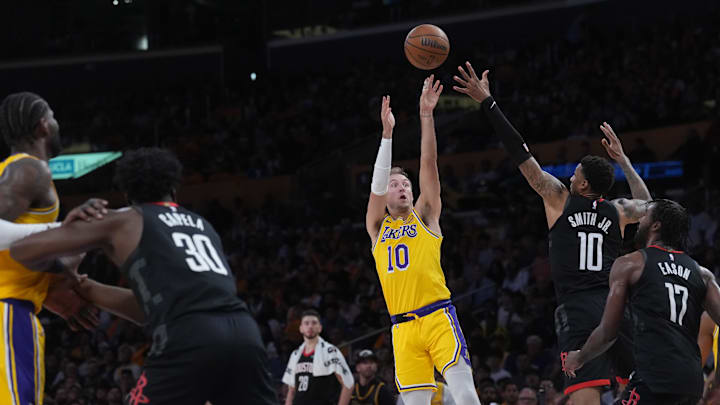 Apr 18, 2026; Los Angeles, California, USA; Los Angeles Lakers guard Luke Kennard (10) shoots the ball against Houston Rockets forward Jabari Smith Jr. (10) in the first half during game one of the first round of the 2026 NBA Playoffs at Crypto.com Arena. Mandatory Credit: Kirby Lee-Imagn Images