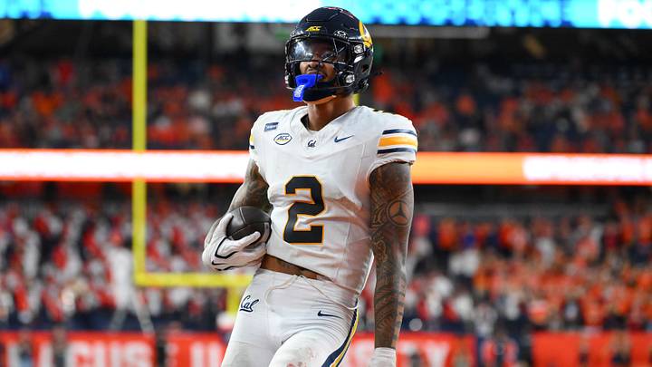 Sep 12, 2026; Syracuse, New York, USA;  California Golden Bears defensive back Kingston Lopa (2) runs into the end zone for a touchdown following his interception during the second half against the Syracuse Orange at the JMA Wireless Dome.  Mandatory Credit: Rich Barnes-Imagn Images