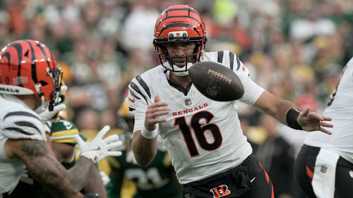 Cincinnati Bengals quarterback Joe Flacco (16) pitches the ball to running back Chase Brown during the third quarter of their game against the Green Bay Packers Sunday, October 12, 2025 at Lambeau Field in Green Bay, Wisconsin.