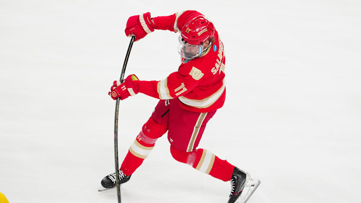 Apr 9, 2026; Las Vegas, Nevada, UNITED STATES; Denver Pioneers forward Samu Salminen (11) attempts a shot on goal in the first period against the Michigan Wolverines in the semifinals of the NCAA men's ice hockey Frozen Four at T-Mobile Arena. Mandatory Credit: Stephen R. Sylvanie-Imagn Images Apr 9, 2026; Las Vegas, Nevada, UNITED STATES; Denver Pioneers forward Samu Salminen (11) attempts a shot on goal in the first period against the Michigan Wolverines in the semifinals of the NCAA men's ice hockey Frozen Four at T-Mobile Arena. Mandatory Credit: Stephen R. Sylvanie-Imagn Images