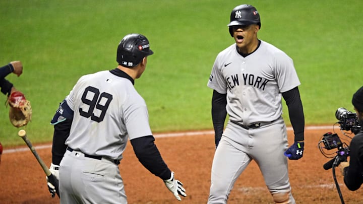 Oct 19, 2024; Cleveland, Ohio, USA; New York Yankees outfielder Juan Soto (22) celebrates with outfielder Aaron Judge (99) after hitting a three run home run during the tenth inning against the Cleveland Guardians during game five of the ALCS for the 2024 MLB playoffs at Progressive Field. Mandatory Credit: David Richard-Imagn Images