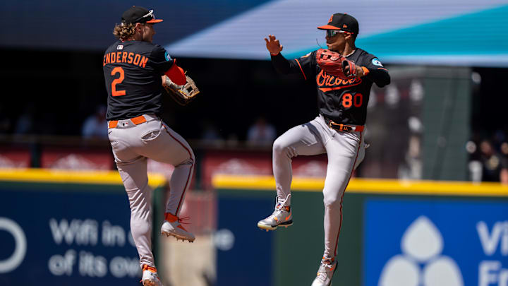 Jun 5, 2025; Seattle, Washington, USA;  Balitimore Orioles centerfielder Jordyn Adams (80) and shortstop Gunnar Henderson (2) celebrate after a game against the Seattle Mariners at T-Mobile Park. Mandatory Credit: Stephen Brashear-Imagn Images