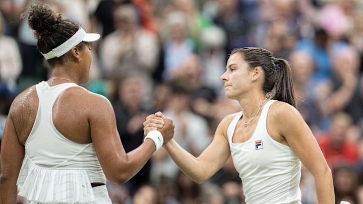 Emma Navarro shakes hands with Naomi Osaka after their second round match at Wimbledon Centre Court. Emma Navarro shakes hands with Naomi Osaka after their second round match at Wimbledon Centre Court.