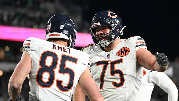 Chicago Bears tight end Cole Kmet (85) celebrates with Ozzy Trapilo (75)