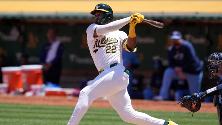 Jun 9, 2024; Oakland, California, USA; Oakland Athletics left fielder Miguel Andujar (22) hits a double against the Toronto Blue Jays during the fourth inning at Oakland-Alameda County Coliseum. 