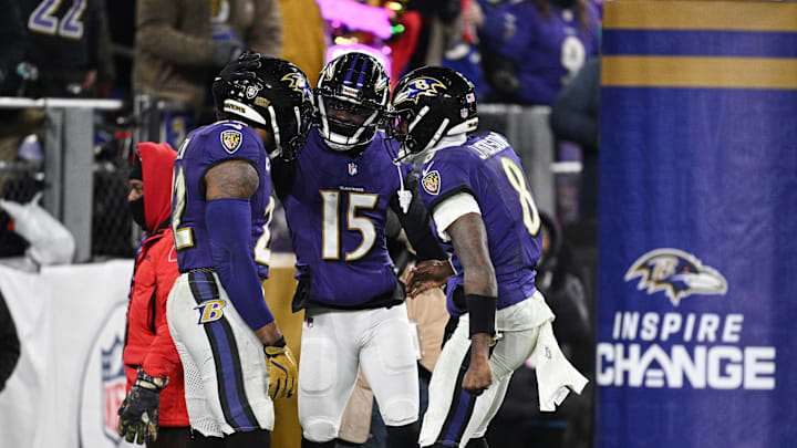 Jan 11, 2025; Baltimore, Maryland, USA; Baltimore Ravens running back Derrick Henry (22) celebrates with wide receiver Nelson Agholor (15) and quarterback Lamar Jackson (8) after scoring a touchdown against the Pittsburgh Steelers in the third quarter in an AFC wild card game at M&T Bank Stadium. Mandatory Credit: Tommy Gilligan-Imagn Images