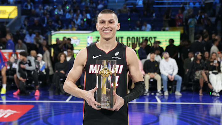 Feb 15, 2025; San Francisco, CA, USA; Miami Heat guard Tyler Herro (14) celebrates with the trophy after winning the three-point contest during All Star Saturday Night ahead of the 2025 NBA All Star Game at Chase Center. Mandatory Credit: Kyle Terada-Imagn Images