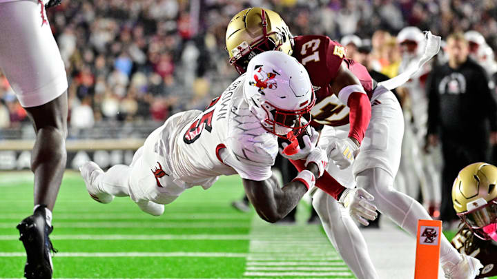 Oct 25, 2024; Chestnut Hill, Massachusetts, USA; Louisville Cardinals running back Isaac Brown (25) dives for a touchdown against the Boston College Eagles during the first half at Alumni Stadium. Mandatory Credit: Eric Canha-Imagn Images Oct 25, 2024; Chestnut Hill, Massachusetts, USA; Louisville Cardinals running back Isaac Brown (25) dives for a touchdown against the Boston College Eagles during the first half at Alumni Stadium. Mandatory Credit: Eric Canha-Imagn Images