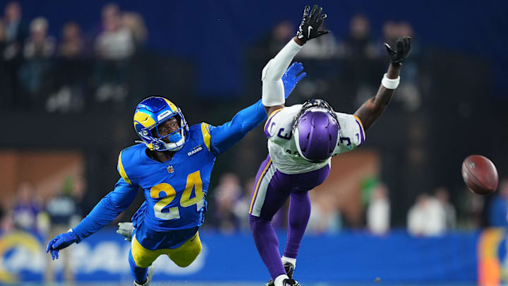 Jan 13, 2025; Glendale, AZ, USA; Minnesota Vikings wide receiver Jordan Addison (3) attempts to make a catch against Los Angeles Rams cornerback Darious Williams (24) during the second half in an NFC wild card game at State Farm Stadium. Mandatory Credit: Joe Camporeale-Imagn Images