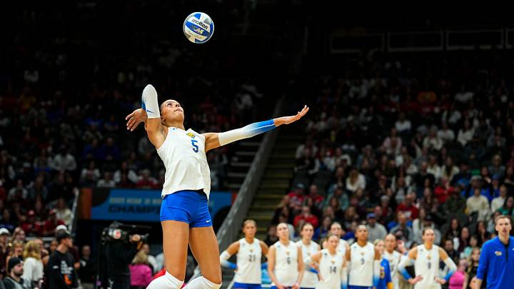 Dec 18, 2025; Kansas City, MO, USA; Pittsburgh Panthers right side hitter Olivia Babcock (5) serves during the second set against the Texas A&M Aggies in a 2025 NCAA Women’s Volleyball Championship semifinal match at T-Mobile Center. Mandatory Credit: Jay Biggerstaff-Imagn Images