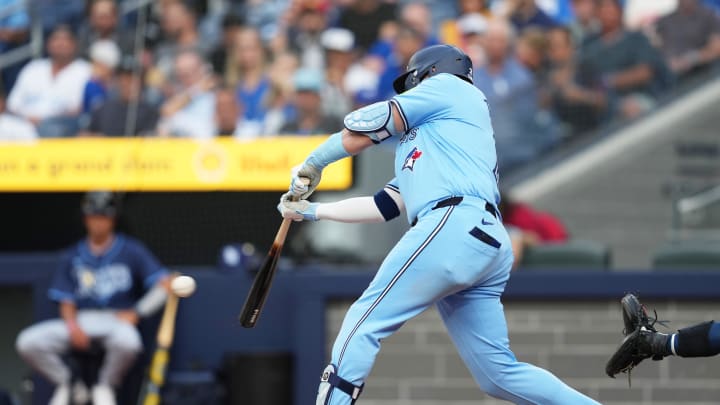 Toronto Blue Jays designated hitter Justin Turner (2) hits a single against the Tampa Bay Rays during the first inning at Rogers Centre on July 23. Toronto Blue Jays designated hitter Justin Turner (2) hits a single against the Tampa Bay Rays during the first inning at Rogers Centre on July 23.