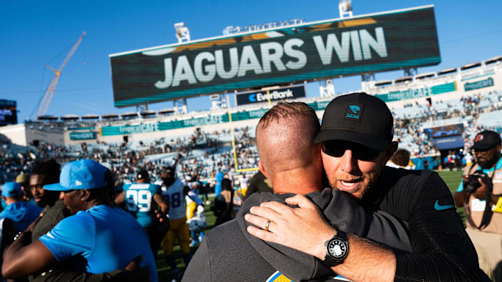 Jacksonville Jaguars head coach Liam Coen gets hug from Charger coaching staff after the Jaguars defeated the Charger 35-6. [Doug Engle/Florida Times-Union]