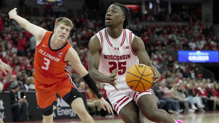 Wisconsin guard John Blackwell (25) drives past Illinois forward Ben Humrichous (3) during the second half of their game Tuesday, February 18, 2025 at the Kohl Center in Madison, Wisconsin. Wisconsin beat Illinois 95-74.