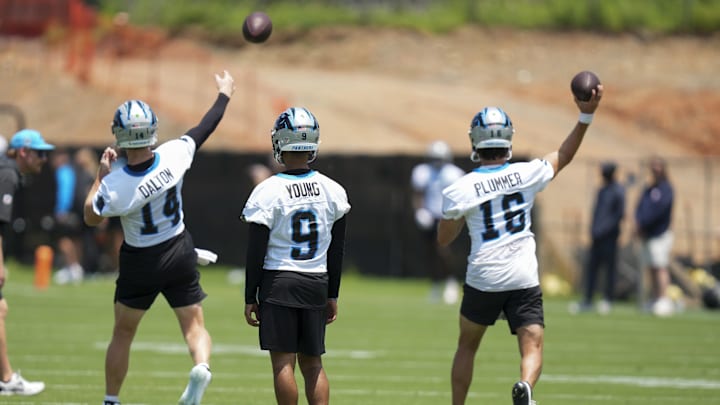 Jun 11, 2025; Charlotte, NC, USA; Carolina Panthers quarterback Bryce Young (9) waits his turn as quarterback Andy Dalton (14) and quarterback Jack Plummer (16) throw during minicamp at Bank of America Stadium. Mandatory Credit: Jim Dedmon-Imagn Images Jun 11, 2025; Charlotte, NC, USA; Carolina Panthers quarterback Bryce Young (9) waits his turn as quarterback Andy Dalton (14) and quarterback Jack Plummer (16) throw during minicamp at Bank of America Stadium. Mandatory Credit: Jim Dedmon-Imagn Images