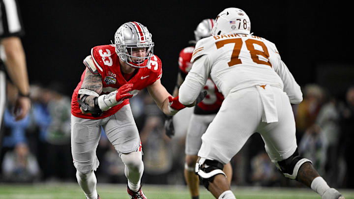 Jan 10, 2025; Arlington, TX, USA; Ohio State Buckeyes defensive end Jack Sawyer (33) rushes against Texas Longhorns offensive lineman Kelvin Banks Jr. (78) during the game at AT&T Stadium. Mandatory Credit: Jerome Miron-Imagn Images Jan 10, 2025; Arlington, TX, USA; Ohio State Buckeyes defensive end Jack Sawyer (33) rushes against Texas Longhorns offensive lineman Kelvin Banks Jr. (78) during the game at AT&T Stadium. Mandatory Credit: Jerome Miron-Imagn Images